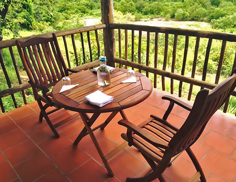 Image of the set up of a personal table outside each tented chalet