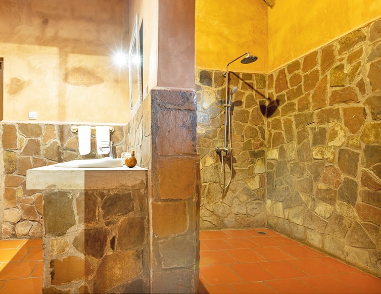 Image of the double vanity and indoor/outdoor shower at the chalets in Zaina Lodge, Mole National Park, Ghana