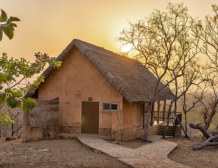 Image of a chalet during sunset at Zaina Lodge, Mole National Park, Ghana