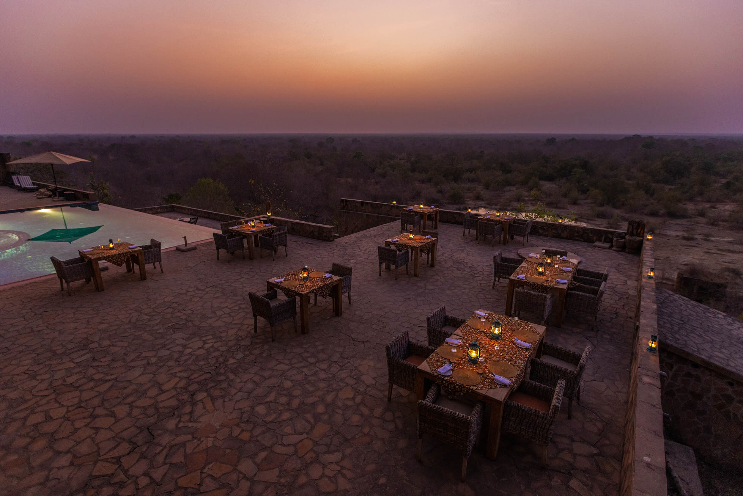 Image of the outdoor dining setup during dinner time at Zaina Lodge, Mole National Park, Ghana