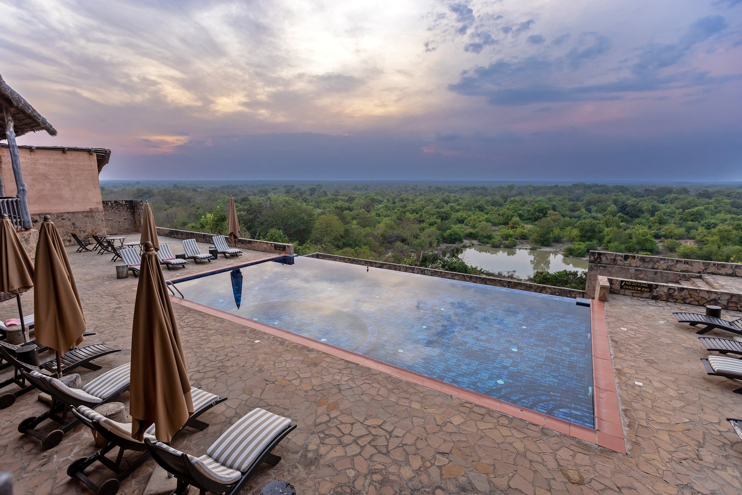 Image of the view of the watering hole and pool at Zaina Lodge, Ghana
